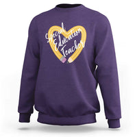 Purple sweatshirt with front heart graphic reading “Special Education Teacher”