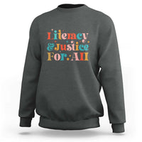 Charcoal crewneck sweatshirt with “Literacy & Justice For All” front graphic