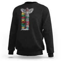 Black crewneck sweatshirt with multicolor totem pole graphic and 'Alaska' text