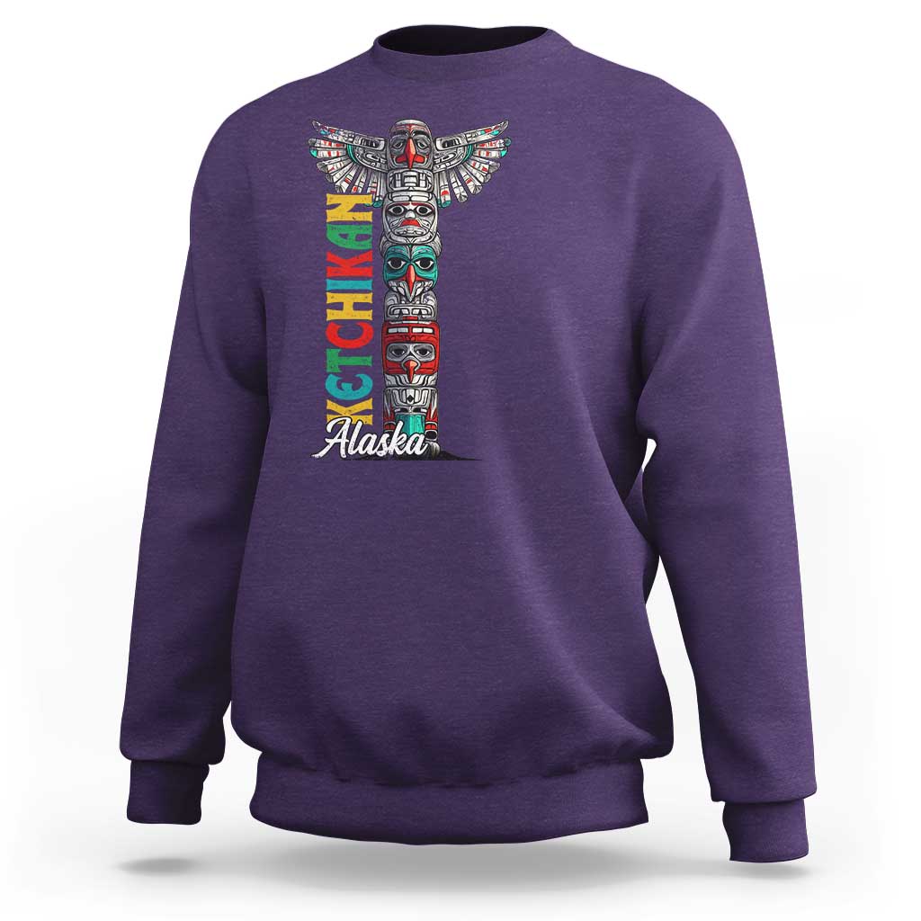 Purple crewneck sweatshirt with multicolor totem pole graphic and 'Alaska' text