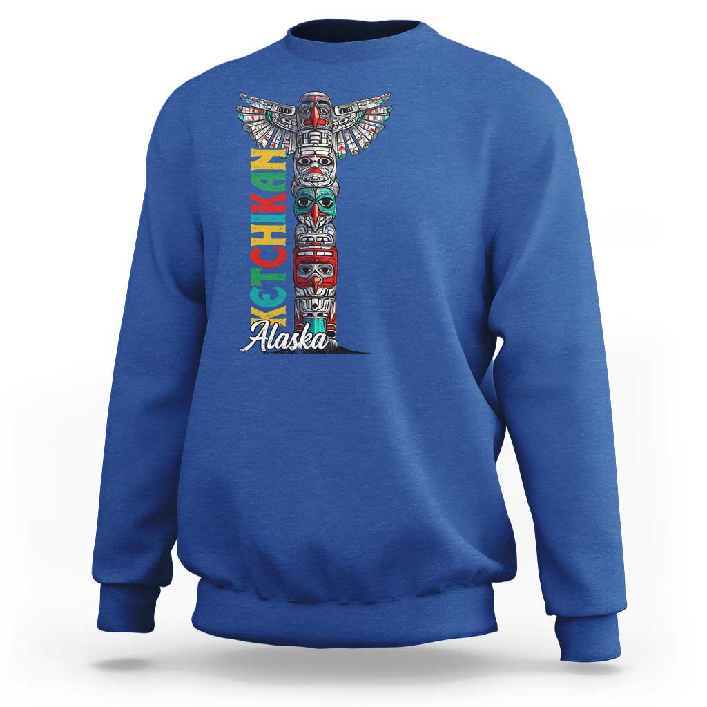 Royal blue crewneck sweatshirt with multicolor totem pole graphic and 'Alaska' text