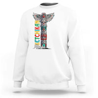 White crewneck sweatshirt with multicolor totem pole graphic and 'Alaska' text