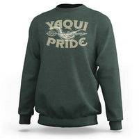 Dark forest green crewneck sweatshirt with Yaqui Pride bird graphic on front