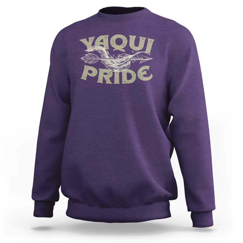 Purple crewneck sweatshirt with Yaqui Pride bird graphic on front