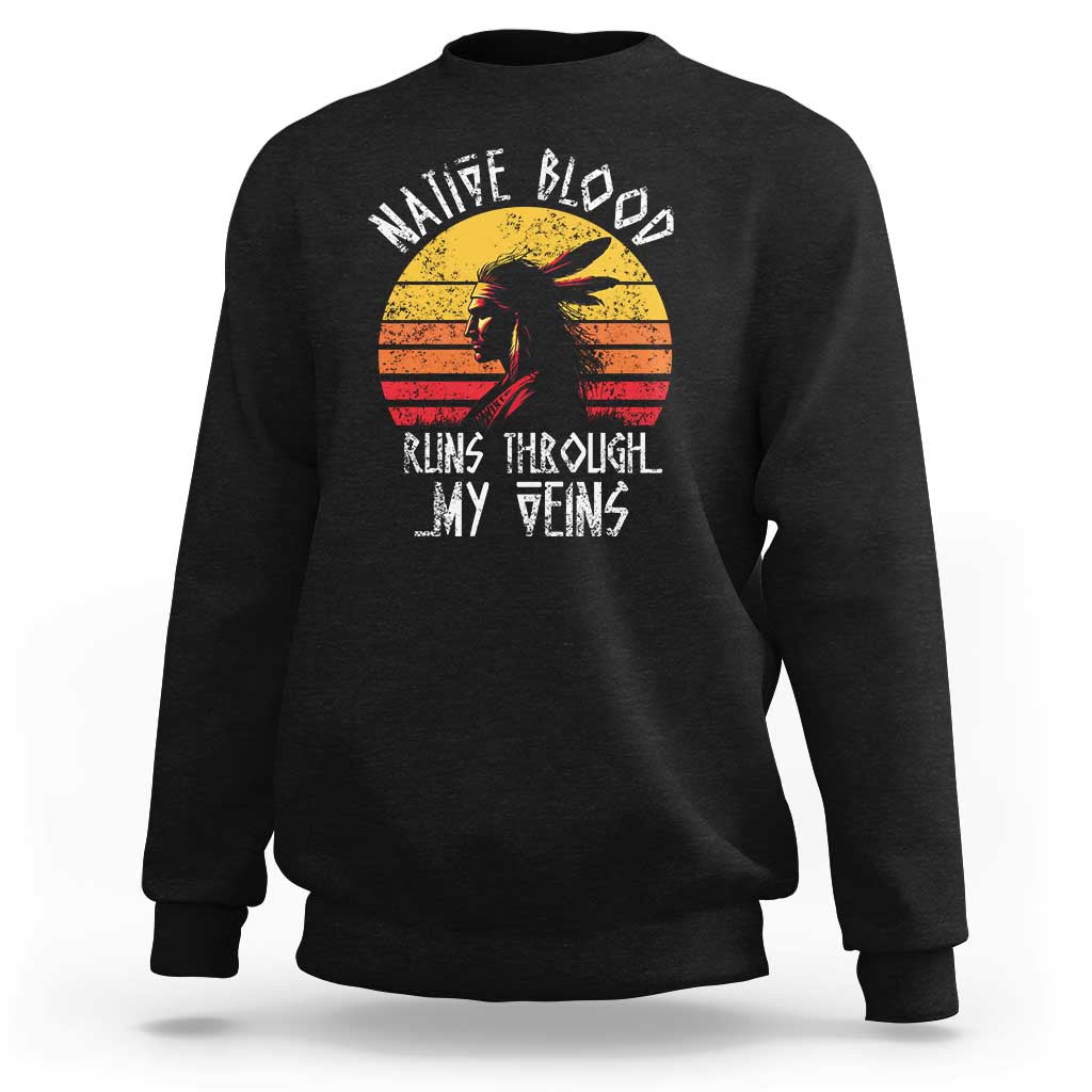 Black crewneck sweatshirt with long sleeves and Native graphic on chest.