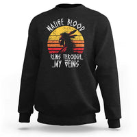 Black crewneck sweatshirt with long sleeves and Native graphic on chest.