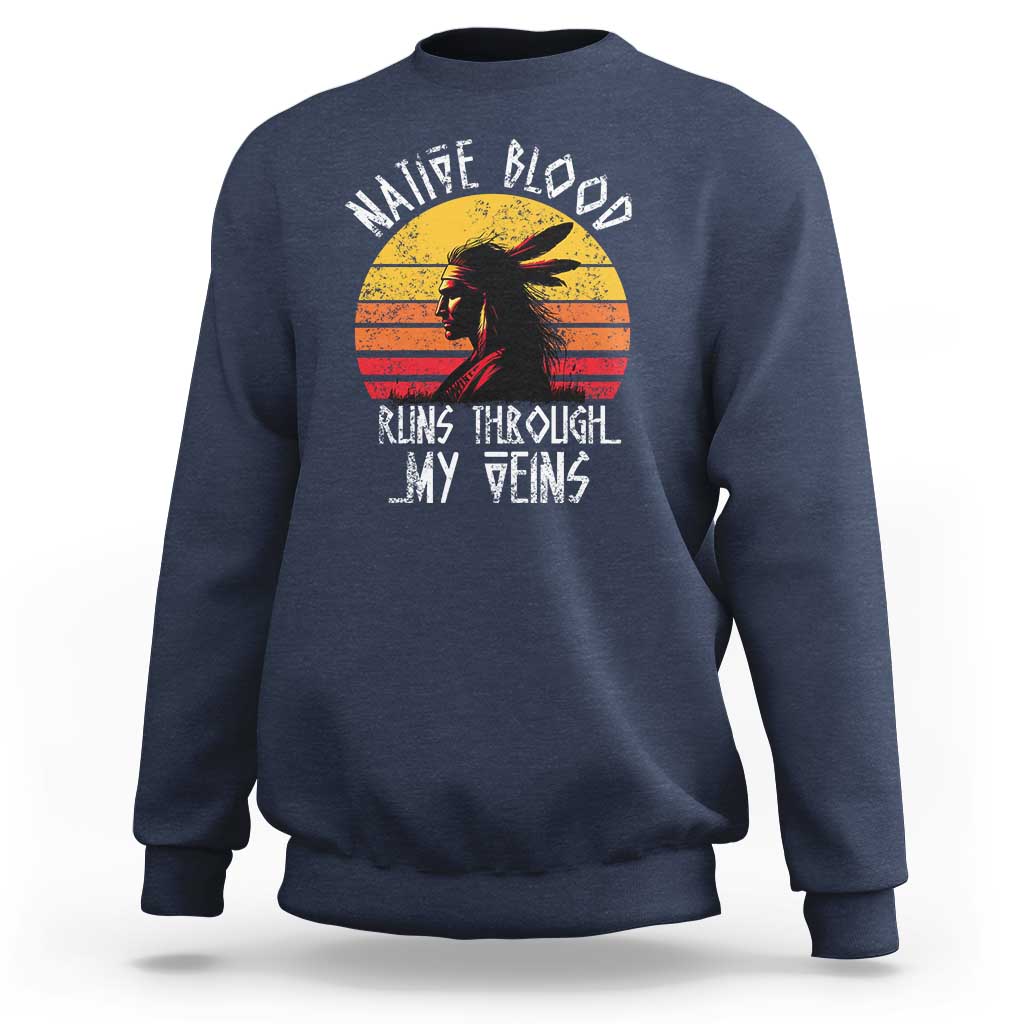 Navy crewneck sweatshirt with long sleeves and Native graphic on chest.