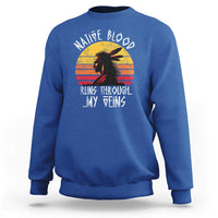Royal blue crewneck sweatshirt with long sleeves and Native graphic on chest.