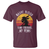 Maroon graphic t-shirt with Native silhouette and sunrise-style slogan design on front