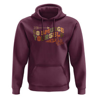Maroon pullover hoodie with kangaroo pocket and colorful front graphic