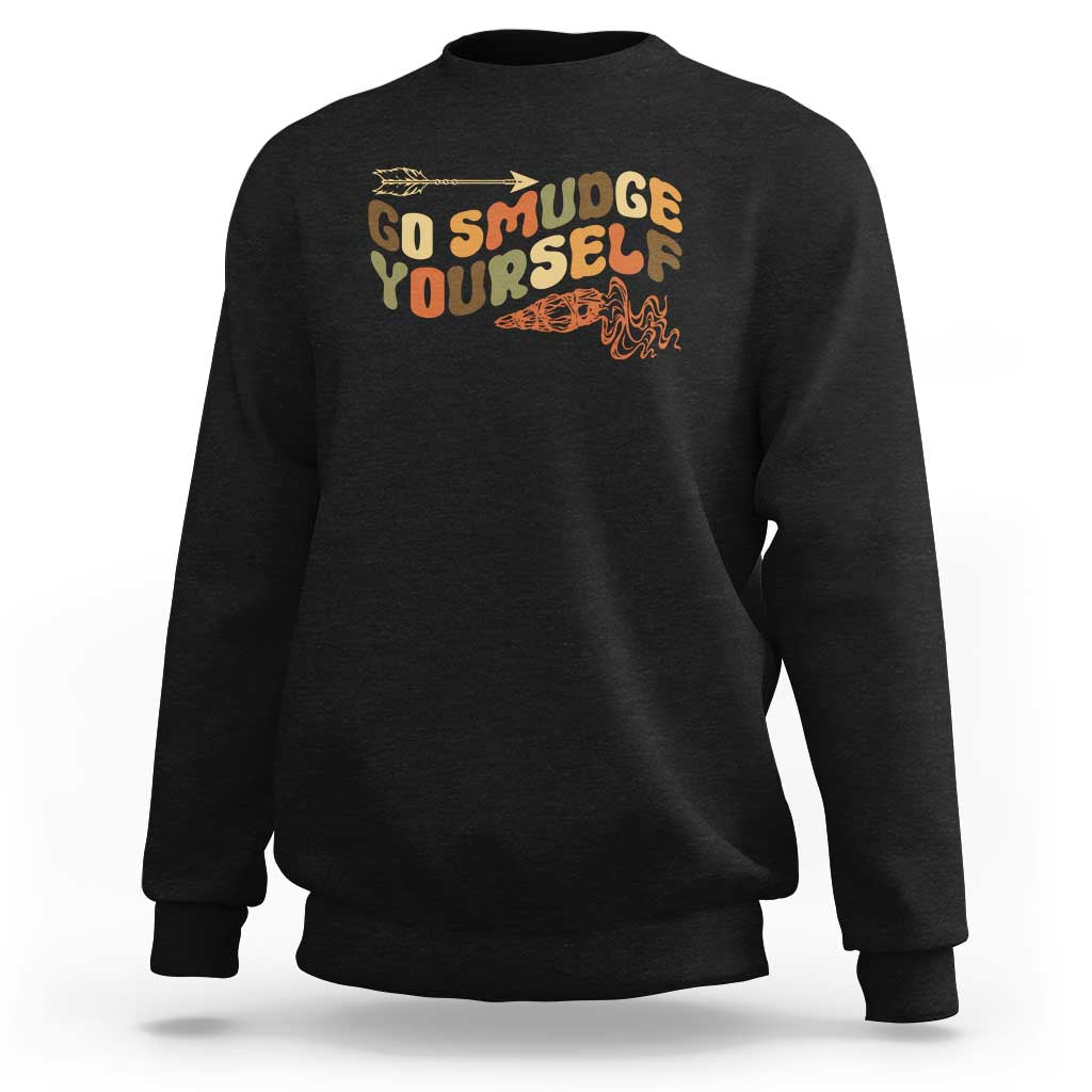 Black crewneck sweatshirt with “Go Smudge Yourself” graphic on the chest