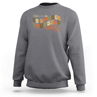 Charcoal gray crewneck sweatshirt with “Go Smudge Yourself” graphic on the chest