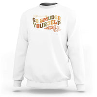 White crewneck sweatshirt with “Go Smudge Yourself” graphic on the chest