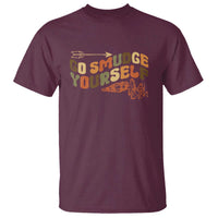 Maroon T-shirt with 'Go Smudge Yourself' graphic slogan and orange outline