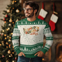 Green ugly Christmas sweater with 'Go Smudge Yourself' graphic, tree icons, and fair-isle stripes.