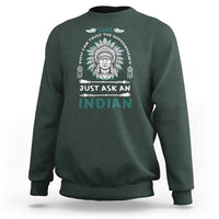 Dark forest green crewneck sweatshirt with Native American head graphic and slogan print