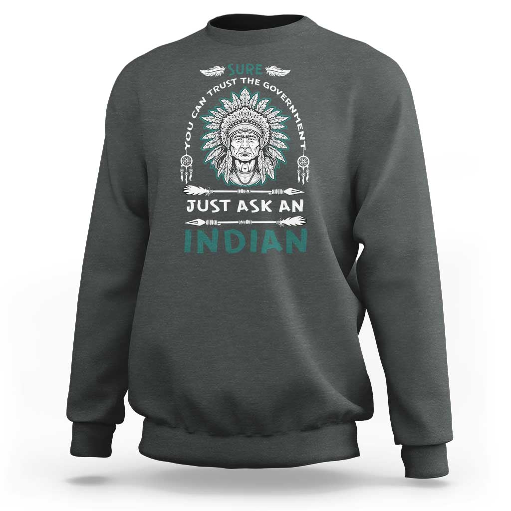 Charcoal gray crewneck sweatshirt with Native American head graphic and slogan print