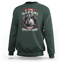 Crewneck sweatshirt, dark forest green, long sleeves, centered illustrated graphic on front