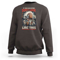 Dark brown crewneck sweatshirt with Native-inspired portrait graphic and red/white front text