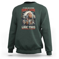 Dark forest green crewneck sweatshirt with Native-inspired portrait graphic and red/white text