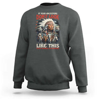 Dark heather gray crewneck sweatshirt with Native-inspired portrait graphic and red/white front text