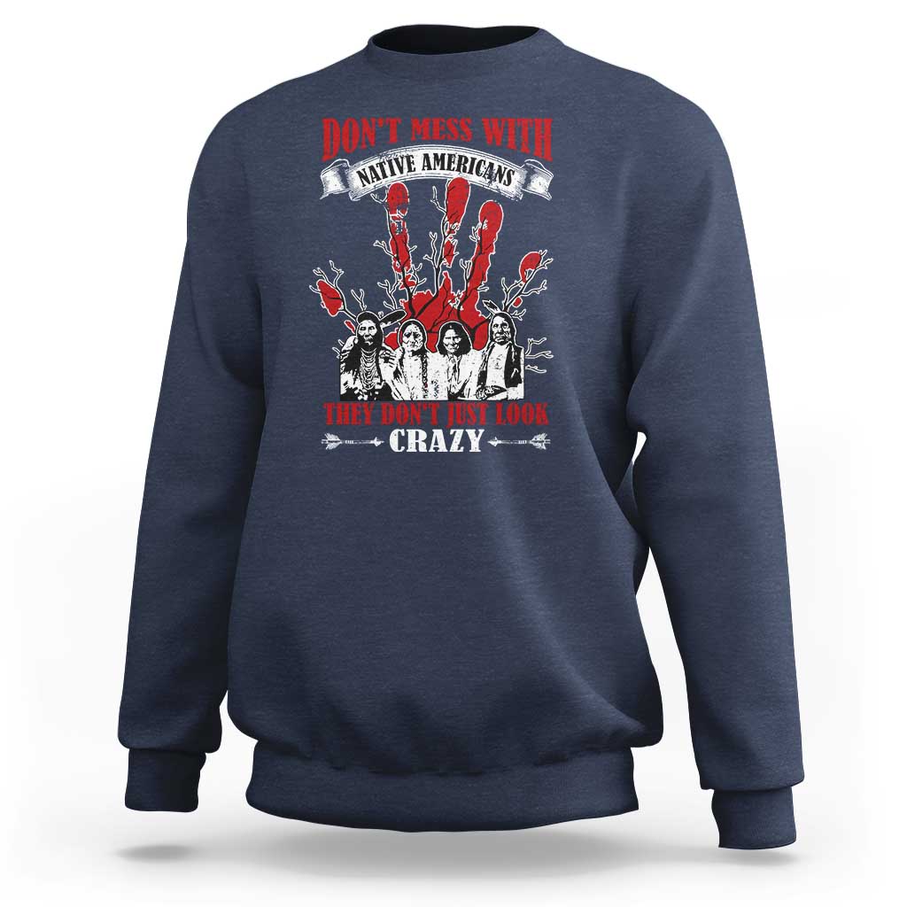 Navy sweatshirt with front graphic text and Native American-style figures in red and white