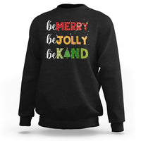 Black Christmas sweatshirt with "be MERRY", "be TOLLY", "be KIND" text and tree