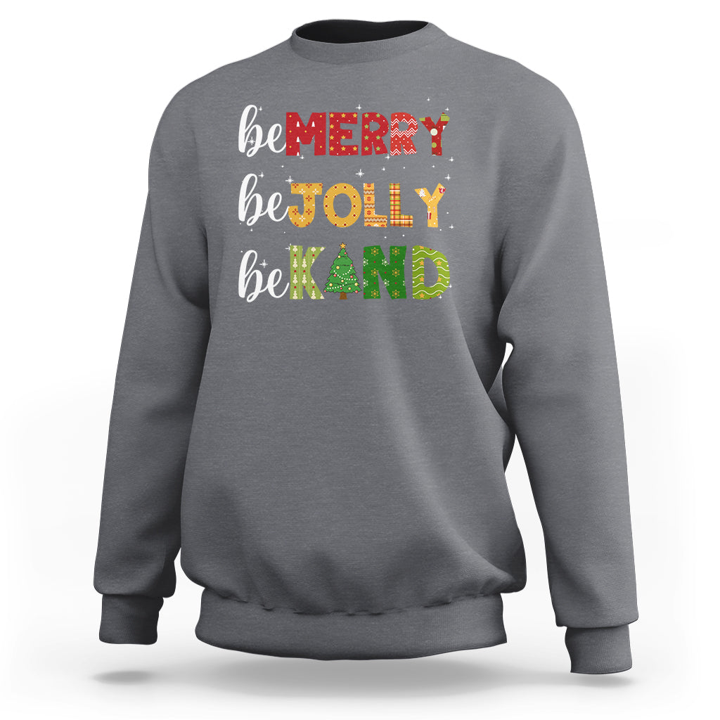 Charcoal gray Christmas sweatshirt with "be MERRY", "be TOLLY", "be KIND" and tree