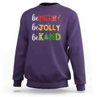 Purple Christmas sweatshirt with "be MERRY", "be TOLLY", "be KIND" text and tree