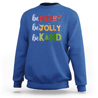 Royal blue Christmas sweatshirt with "be MERRY", "be TOLLY", "be KIND" text and tree