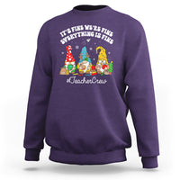 Purple crewneck sweatshirt with holiday gnome TeacherCrew graphic.