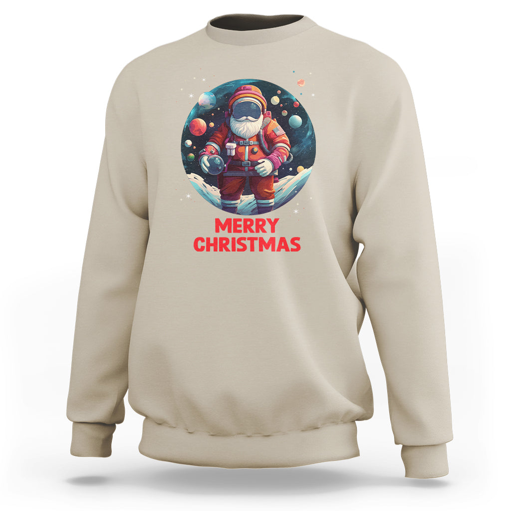 Sand Christmas sweatshirt with astronaut Santa graphic and “Merry Christmas” text