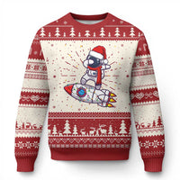 Red ugly Christmas sweater with dabbing astronaut Santa and festive fair-isle border