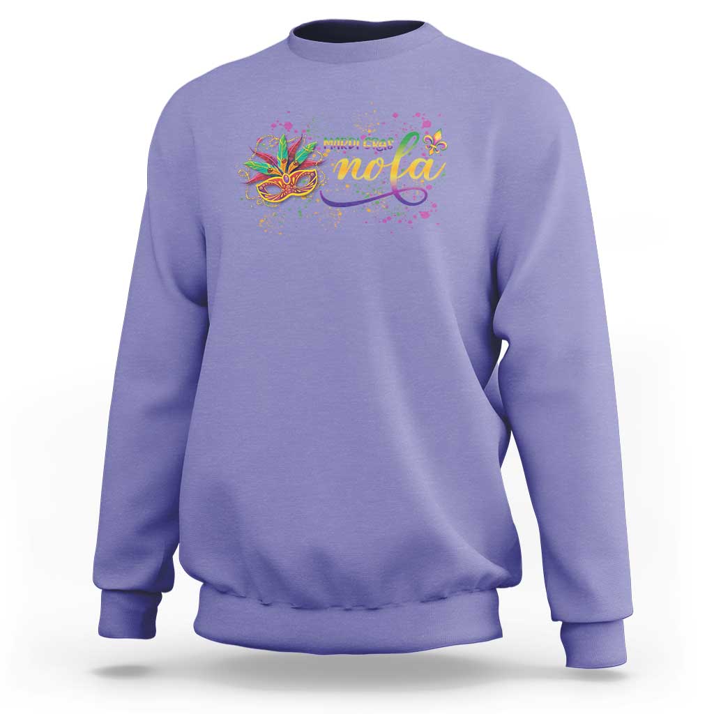 Violet crewneck sweatshirt with colorful Mardi Gras mask and “nola” graphic on chest