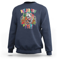 Navy sweatshirt with “But Did You Dye?!” skeleton egg basket graphic on chest