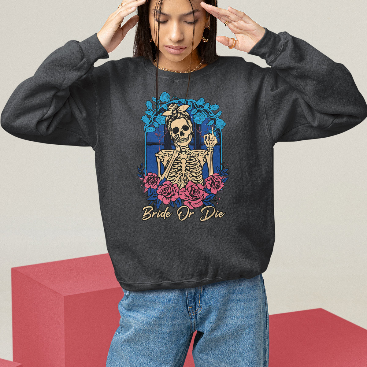 Black sweatshirt with front skeleton graphic and blue/pink floral wreath print, crew neck