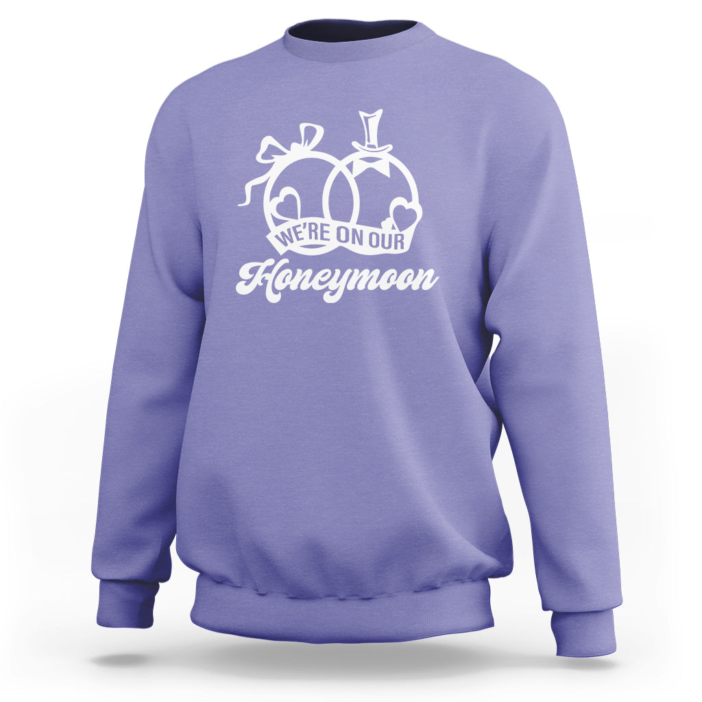 Violet crewneck sweatshirt with Honeymoon graphic