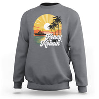 Charcoal gray sweatshirt with “Honey Moonin” beach graphic and palm tree print