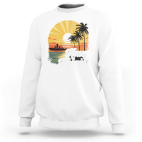 White sweatshirt with “Honey Moonin” beach graphic and palm tree print