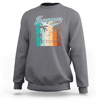 Charcoal gray crewneck sweatshirt with 'Honeymoon' beach graphic panel at chest