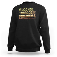 Black crewneck sweatshirt with Alcohol Tobacco Firearms front graphic.