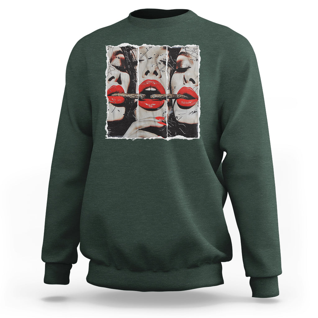 Dark green crewneck sweatshirt with front graphic of stylized faces and red lips