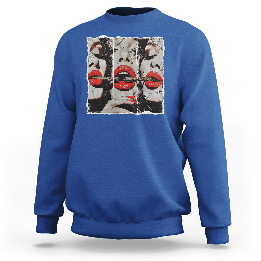 Royal blue crewneck sweatshirt with front graphic of stylized faces and red lips