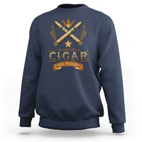 Blue crewneck sweatshirt with front graphic of crossed cigars and crown