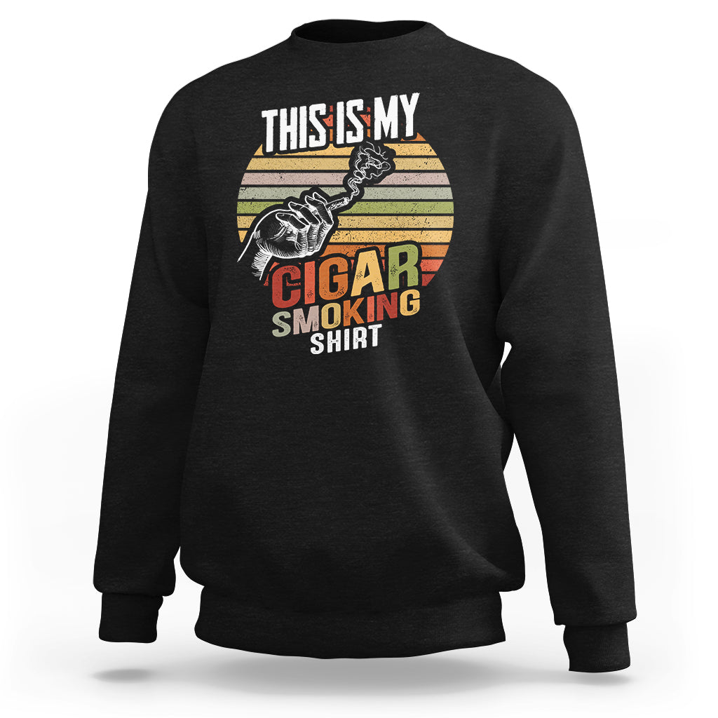 Black sweatshirt with front graphic showing a cigar and “Cigar Smoking”