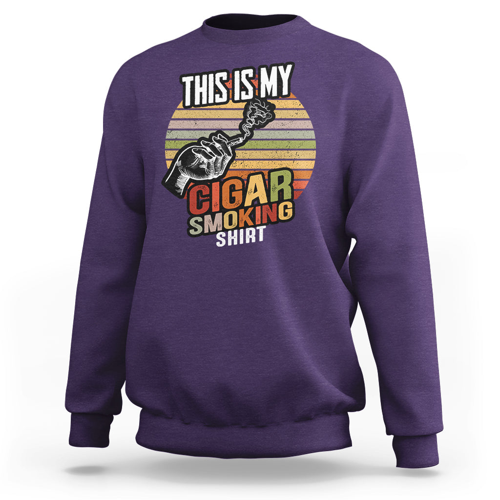 Purple sweatshirt with front graphic: “This Is My Cigar Smoking”