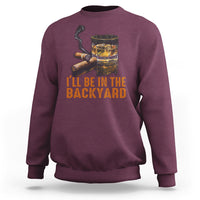 Maroon sweatshirt with whiskey glass and cigars graphic; text 'I'll be in the backyard'.