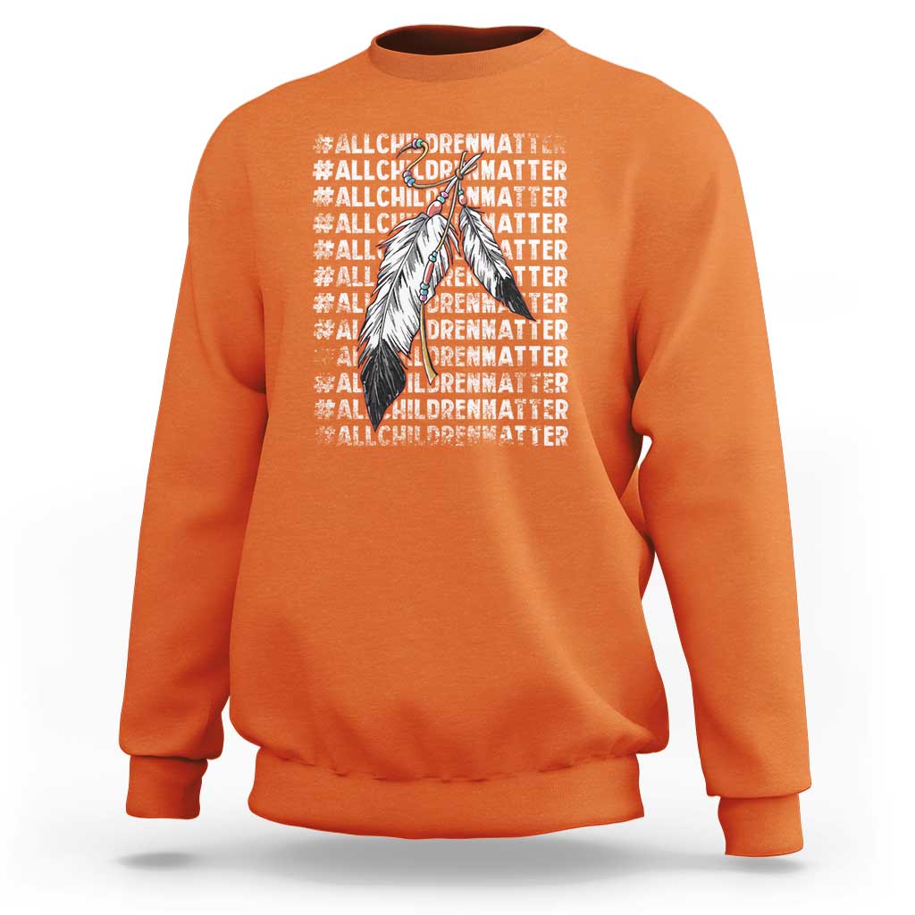 Orange kids sweatshirt with front Native-inspired feather graphic and “All Children Matter” text
