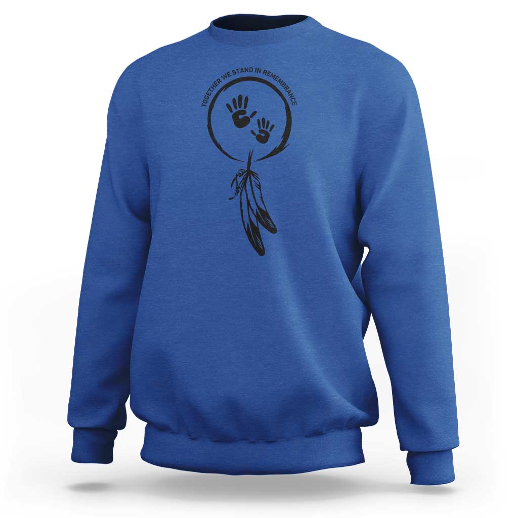 Royal blue sweatshirt with circular hand and dreamcatcher-style graphic on chest