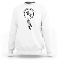White sweatshirt with circular hand and dreamcatcher-style graphic on chest